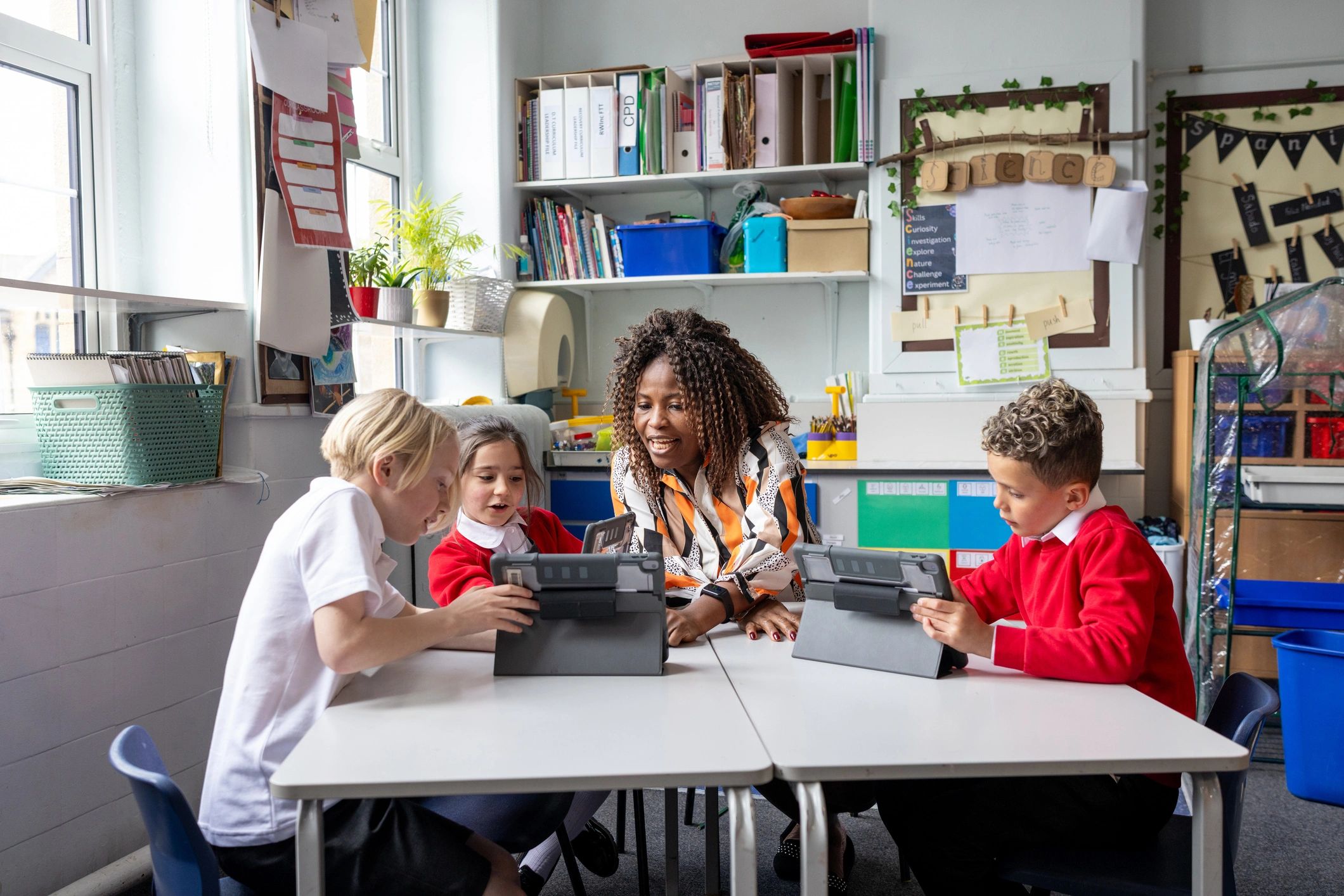Teacher working with students using classroom technology