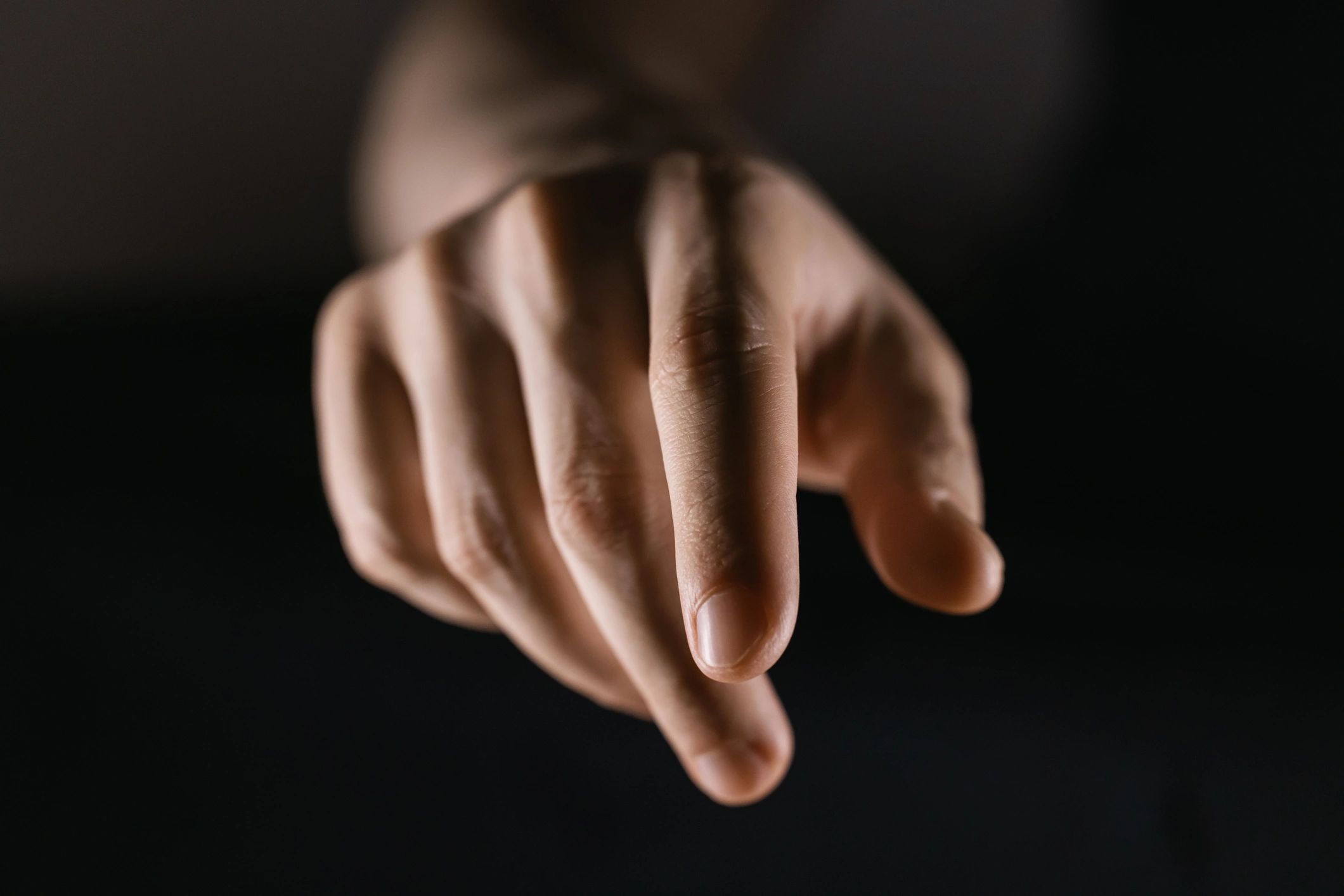 Close-up of a hand interacting with a touchscreen